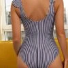 Striped Frill Trim One Piece Swimsuit -Curated Swimwear 16487903663ff81c826a646323bc499256612d169e thumbnail 405x552