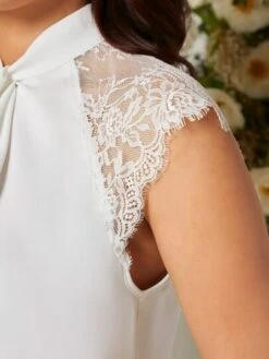 SHEIN Maternity Contrast Lace Raglan Sleeve Twist Front Keyhole Back Blouse -Curated Swimwear 1679622454a892ece68eb442d93f86d2ac18643487 thumbnail 405x552