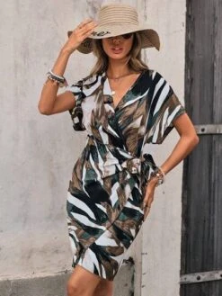 SHEIN Clasi Allover Print Batwing Sleeve Knot Side Wrap Dress -Curated Swimwear 168541714483444af4e0617db82961676ebec93c3b thumbnail 405x552