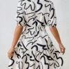 SHEIN Essnce Allover Print Belted Shirt Dress -Curated Swimwear 1687152503a349e3e9c5fae47291272da36ada286c thumbnail 405x552